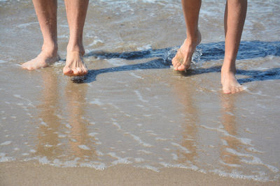 Low section of people on beach