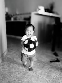 Portrait of smiling boy at home