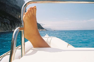 Close-up of the foot of a woman on a boat