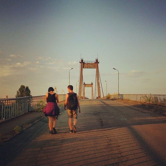 full length, rear view, lifestyles, men, walking, togetherness, leisure activity, built structure, bonding, person, sky, architecture, railing, casual clothing, childhood, the way forward, boys, love