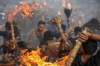 Group of people against fire