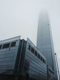 Low angle view of skyscrapers against sky