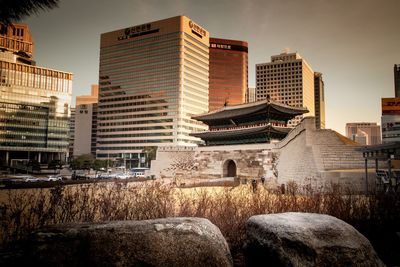 Modern buildings against sky in city