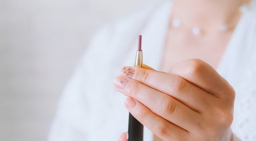 Close-up of woman holding hands