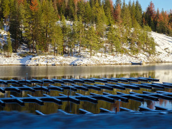 Scenic view of boat docks in lake during winter