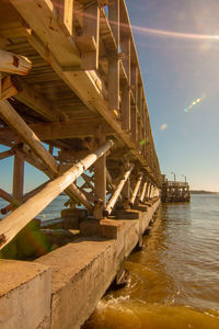 Pier over sea against sky