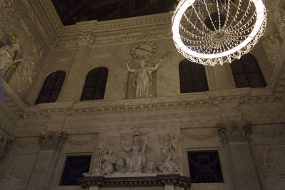 Low angle view of chandelier on building