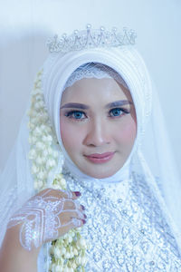 Portrait of young woman wearing hijab