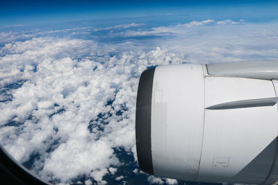 Cropped image of airplane against sky