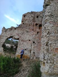 Full length of man walking against old ruins