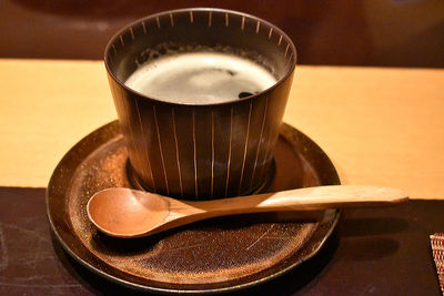 Close-up of coffee cup on table