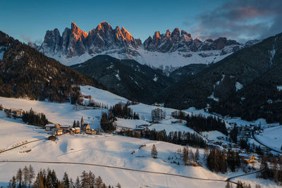 Scenic view of snow covered mountains against sky