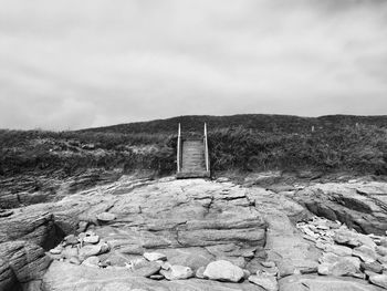 Scenic view of landscape against cloudy sky