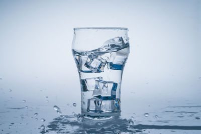 Close-up of water in glass against white background