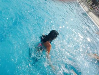 People swimming in sea