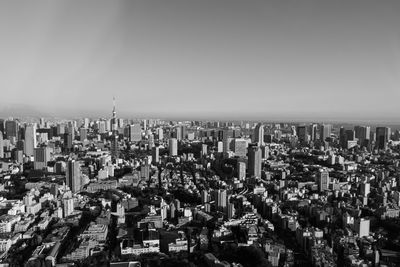 High angle view of modern buildings in city against clear sky