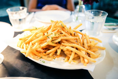 High angle view of french fries in plate on table