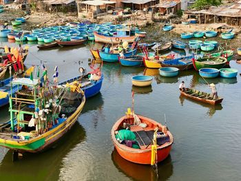 High angle view of fishing boats moored at harbor