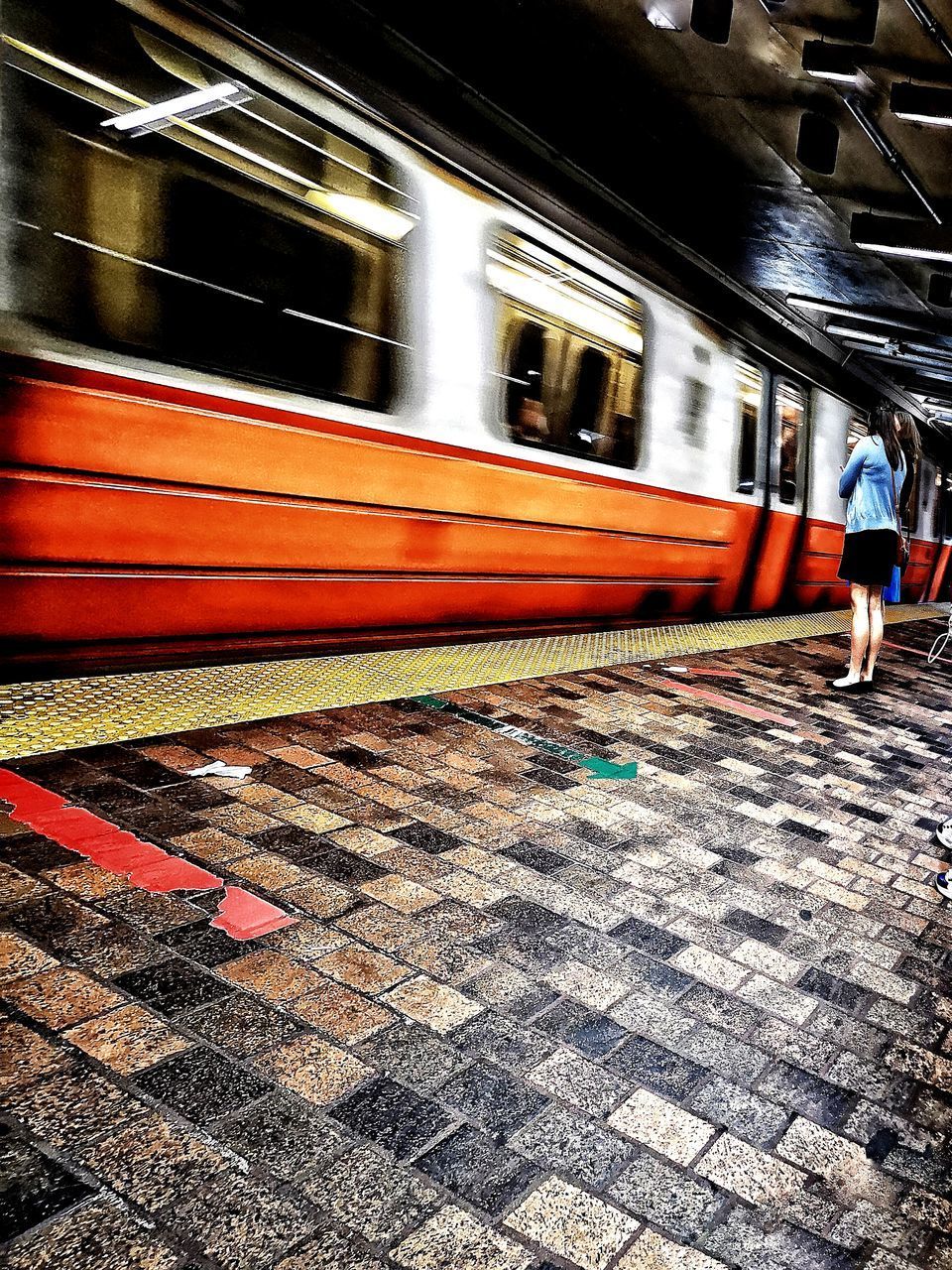 TRAIN ON RAILROAD STATION PLATFORM