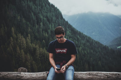 Full length of young man looking at mountains