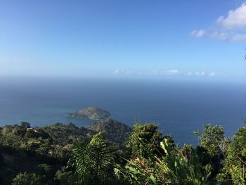 Scenic view of sea against blue sky