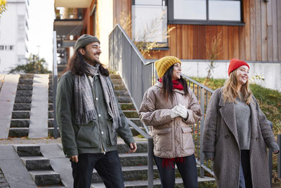 View of friends walking together