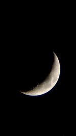 Low angle view of moon against sky at night