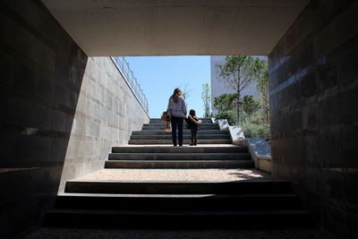 Mother and daughter on stairs