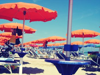 Multi colored umbrellas against blue sky