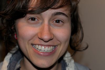 Close-up portrait of a smiling young woman