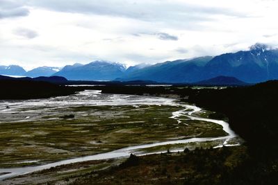 Scenic view of snowcapped mountains against sky