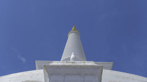 Low angle view of temple against blue sky