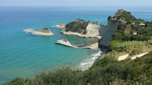 Scenic view of sea against blue sky