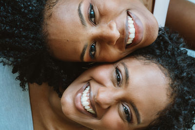 Close up two african woman next to each other portrait