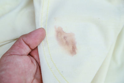 Close-up of person holding hand