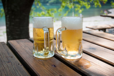 Close-up of beer glass on table