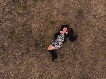 Full length of woman standing on field