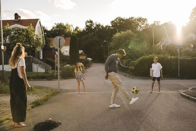 People playing with ball in park