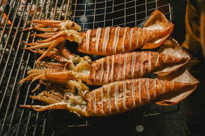 High angle view of seafood cooking on barbecue grill