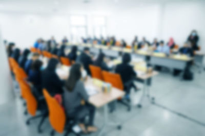 Close-up of multi colored chairs on table