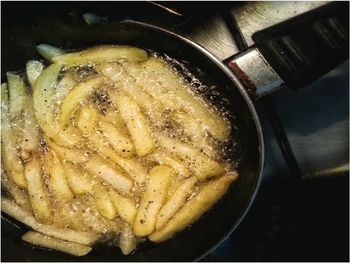 Close-up of meat in cooking pan