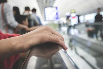 Close-up of man hand on bus