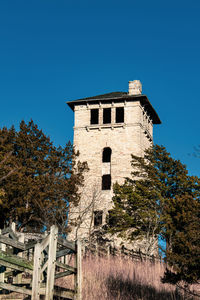 Low angle view of building against clear blue sky