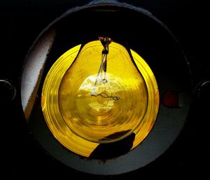 Close-up of illuminated lamp at night