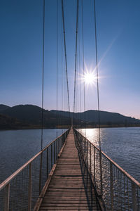 Pier over sea against sky