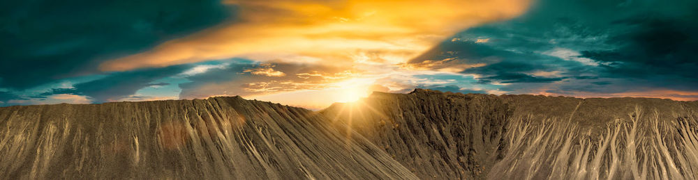 Panoramic view of landscape against sky during sunset