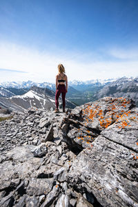 Hiker on top of mountain in kananaskis country in canadian rockies