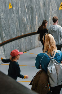 Rear view of people walking outdoors