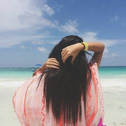 Rear view of woman on beach