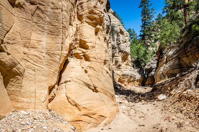 Low angle view of rock formation against sky